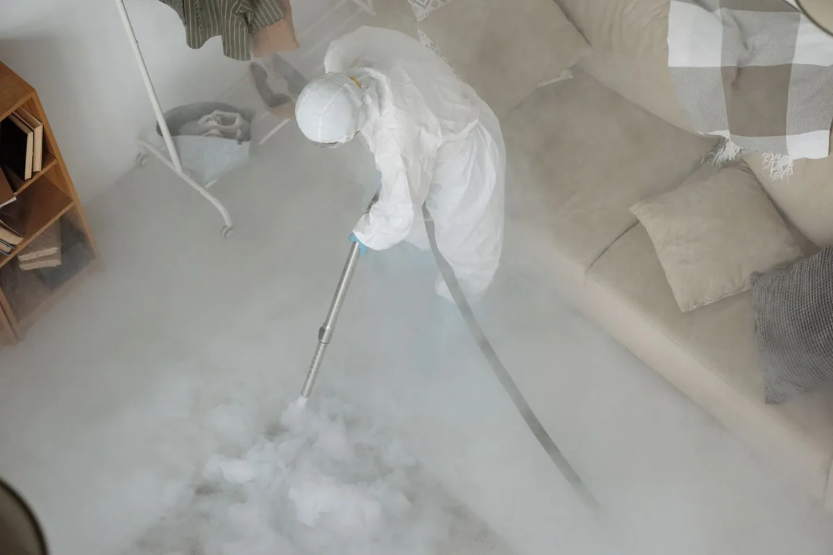 Biohazard cleanup technician in protective equipment, Dousman, WI